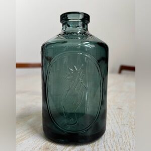 Green Glass Bottle with Embossed Design
